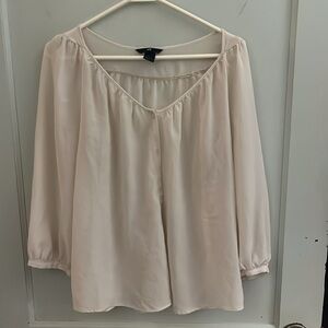 Womens blouse crème in color. Size 10 brand is H and M